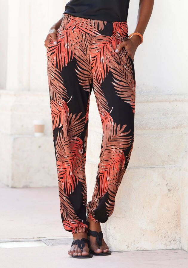 Lascana Strandbroek met print van palmbladeren en zakken lichtgewicht en elastische jersey broek