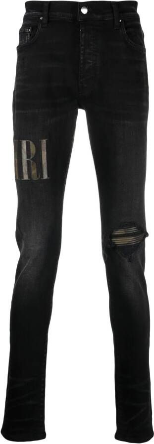 AMIRI Gerafelde jeans met logo-applicatie Zwart