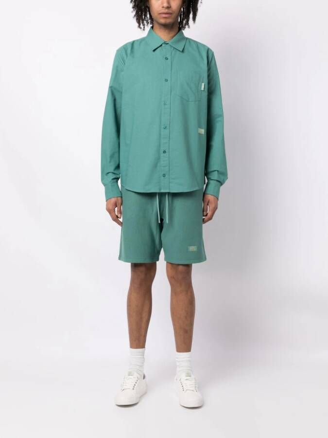 Advisory Board Crystals Trainingsshorts met geborduurd logo Groen