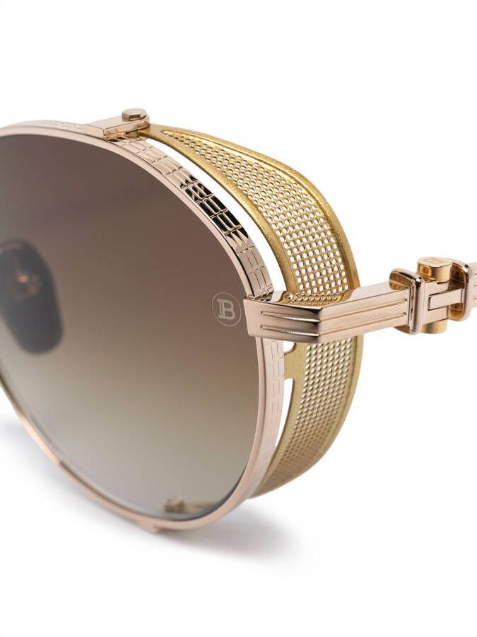 Balmain Eyewear x Akoni zonnebril met rond montuur Goud