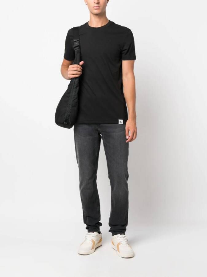 Calvin Klein Jeans mid-rise slim-fit jeans Zwart