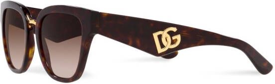 Dolce & Gabbana Eyewear Zonnebril met gekruist montuur Bruin