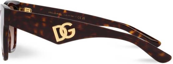 Dolce & Gabbana Eyewear Zonnebril met gekruist montuur Bruin