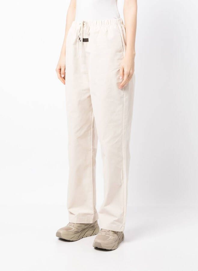 FEAR OF GOD ESSENTIALS Trainingsbroek met logostreep Beige