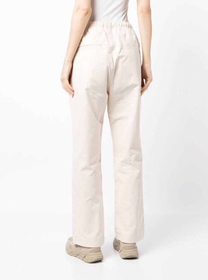 FEAR OF GOD ESSENTIALS Trainingsbroek met logostreep Beige