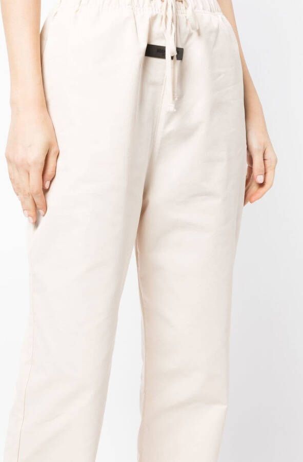 FEAR OF GOD ESSENTIALS Trainingsbroek met logostreep Beige