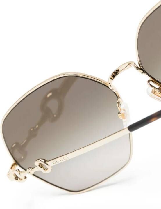 Gucci Eyewear Horsebit zonnebril met rond montuur Goud