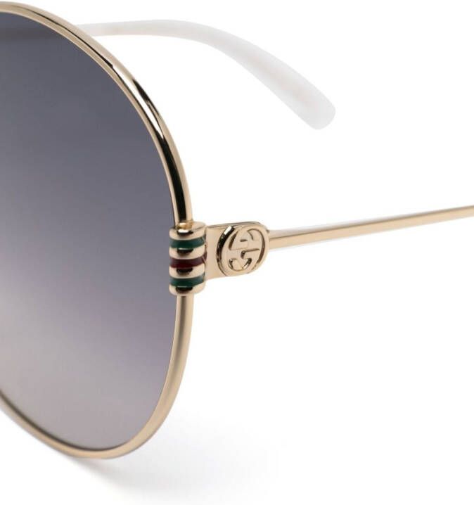 Gucci Eyewear Zonnebril met rond montuur Goud