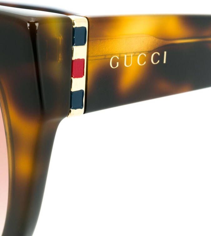 Gucci Eyewear Zonnebril met kattenoog montuur Bruin