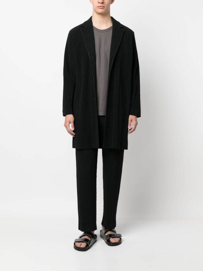 Homme Plissé Issey Miyake Mantel met enkele rij knopen Zwart