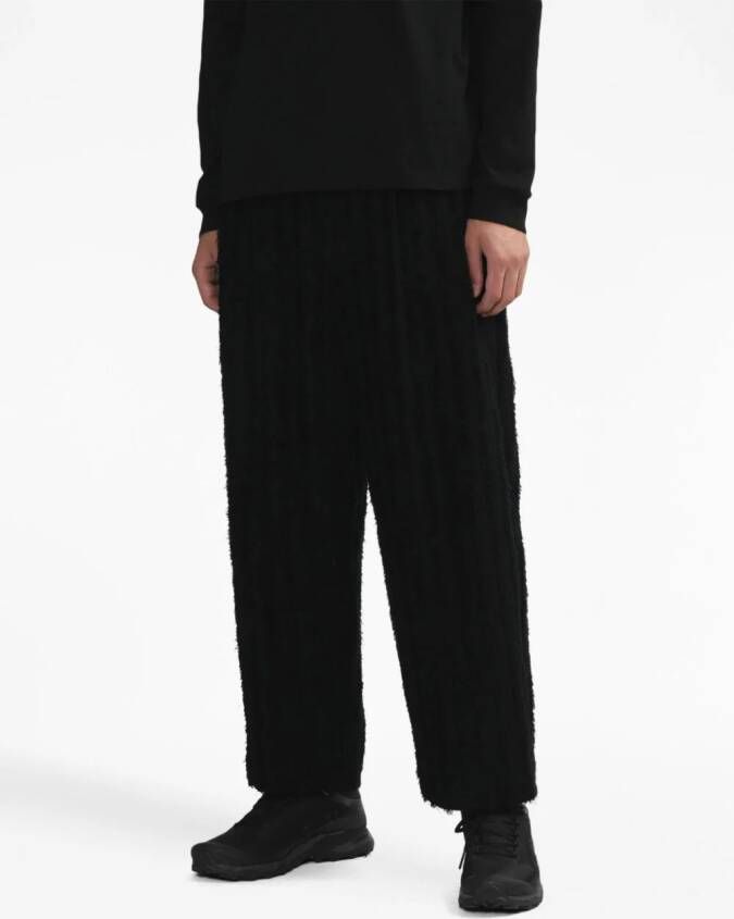 Junya Watanabe MAN Broek met wijde pijpen Zwart