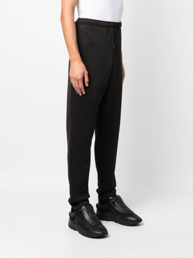 Raf Simons Trainingsbroek met toelopende pijpen Zwart