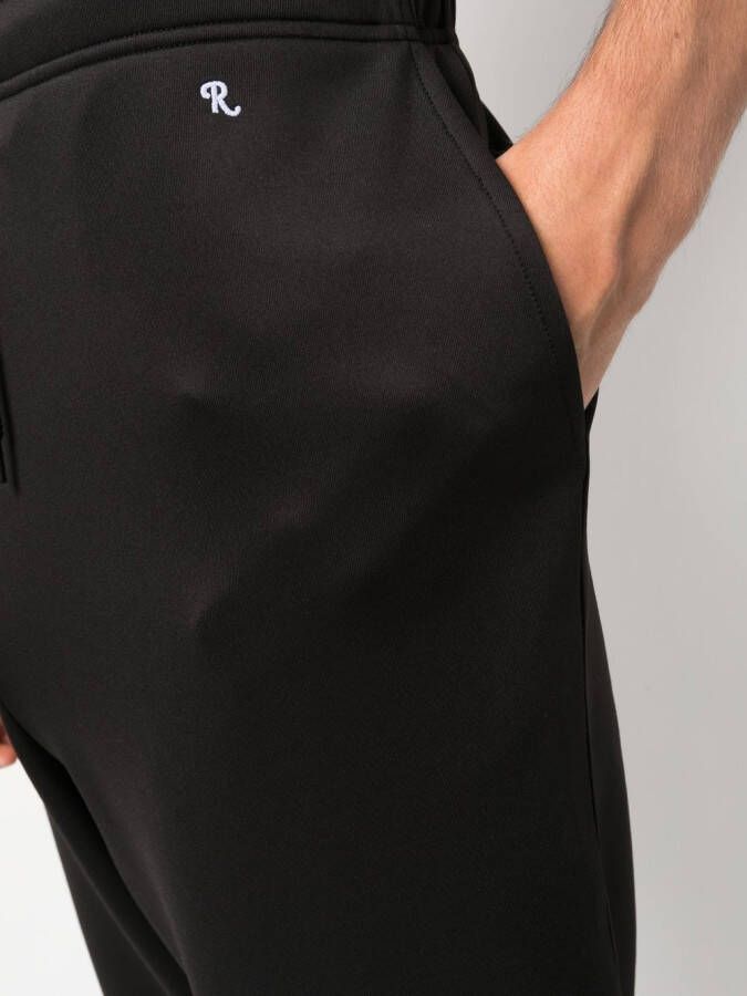 Raf Simons Trainingsbroek met toelopende pijpen Zwart
