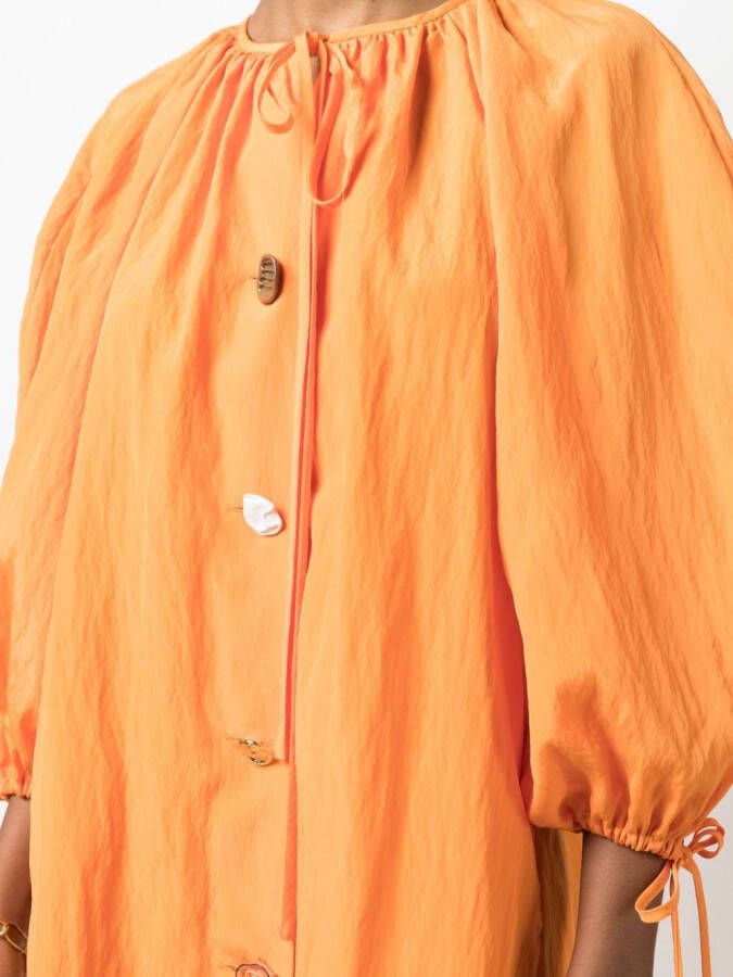 Rejina Pyo Jurk met kenmerkende knoop Oranje