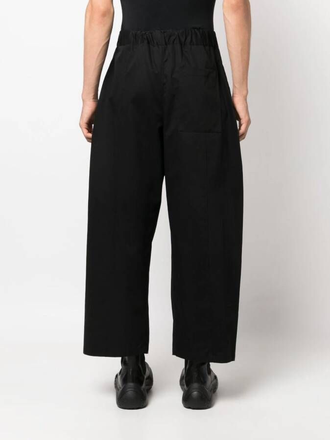 SAGE NATION box-pleat wide-leg trousers Zwart