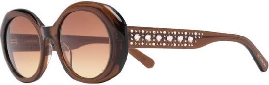 Swarovski Zonnebril met ovaal montuur Bruin