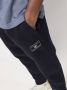 Tommy Hilfiger Trainingsbroek met toelopende pijpen Blauw - Thumbnail 5