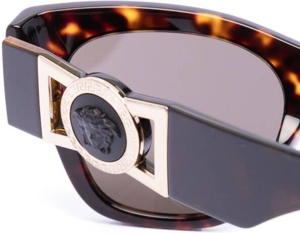 Versace Eyewear Zonnebril met rond montuur Bruin