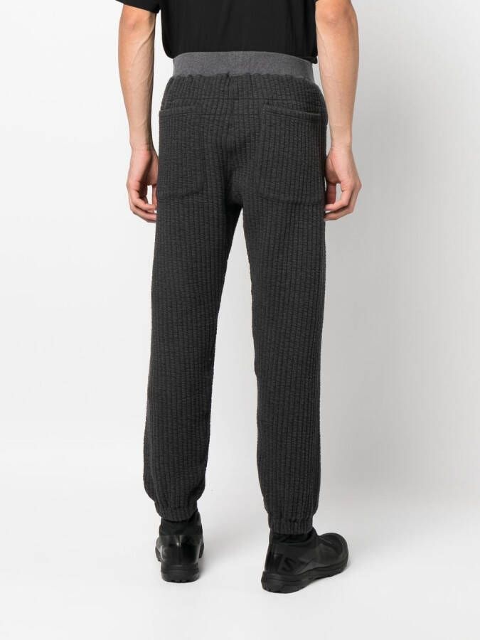 White Mountaineering Geribbelde trainingsbroek Grijs