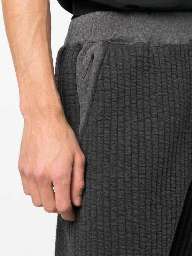 White Mountaineering Geribbelde trainingsbroek Grijs