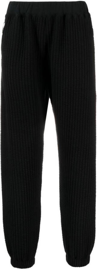 White Mountaineering Geribbelde trainingsbroek Zwart