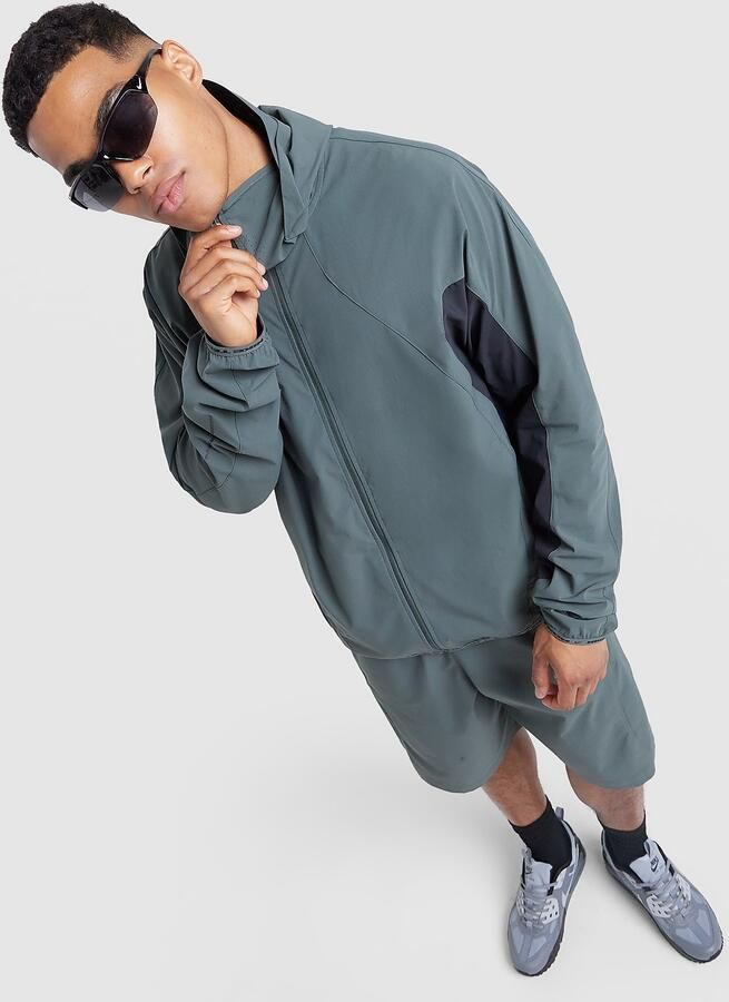 Nike Dri-FIT shell met lange mouwen voor heren Tech Helios Groen- Heren Groen