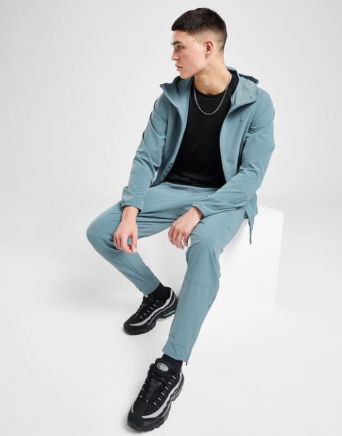 Nike Dri-FIT veelzijdige herenbroek met ritsboord Unlimited Blauw- Heren Blauw