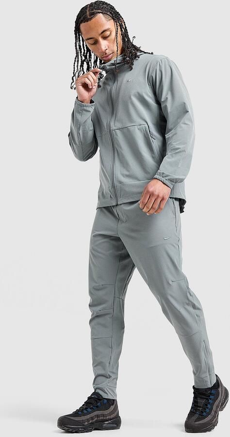 Nike Dri-FIT veelzijdige herenbroek met ritsboord Unlimited Grijs- Heren Grijs
