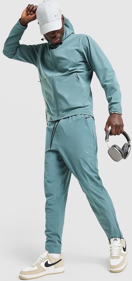 Nike Dri-FIT veelzijdige herenbroek met ritsboord Unlimited Grijs- Heren Grijs