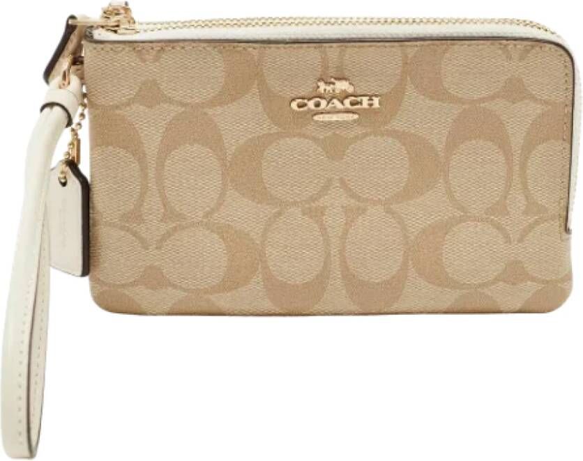 Coach Pre-owned Coated canvas clutches Beige Dames