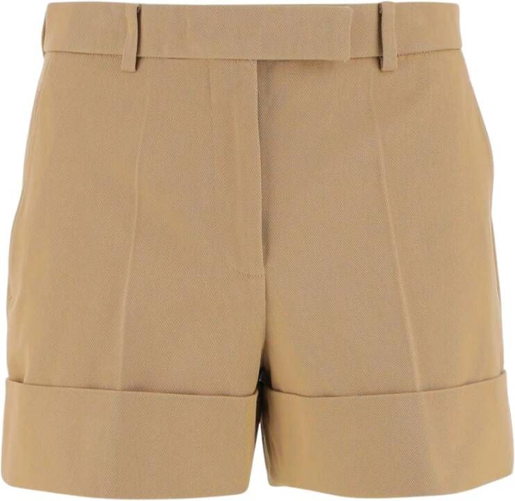 Thom Browne Tailored short pants made of cotton Waist with belt loops Hook button and zipper front closure Two side pockets Ironed pleats Bottom leg with turn-ups Tricolor puller detail on back welt pockets with button Khaki Made in Italy Composition: 100% cotton Groen Dames