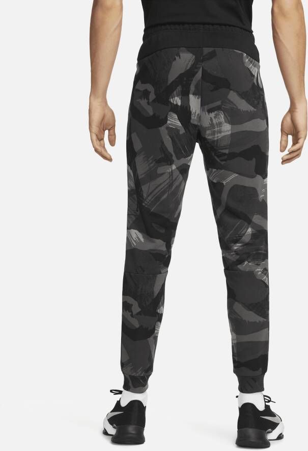 Nike Dri-FIT fitnessbroek met taps toelopend design en camouflageprint voor heren Zwart