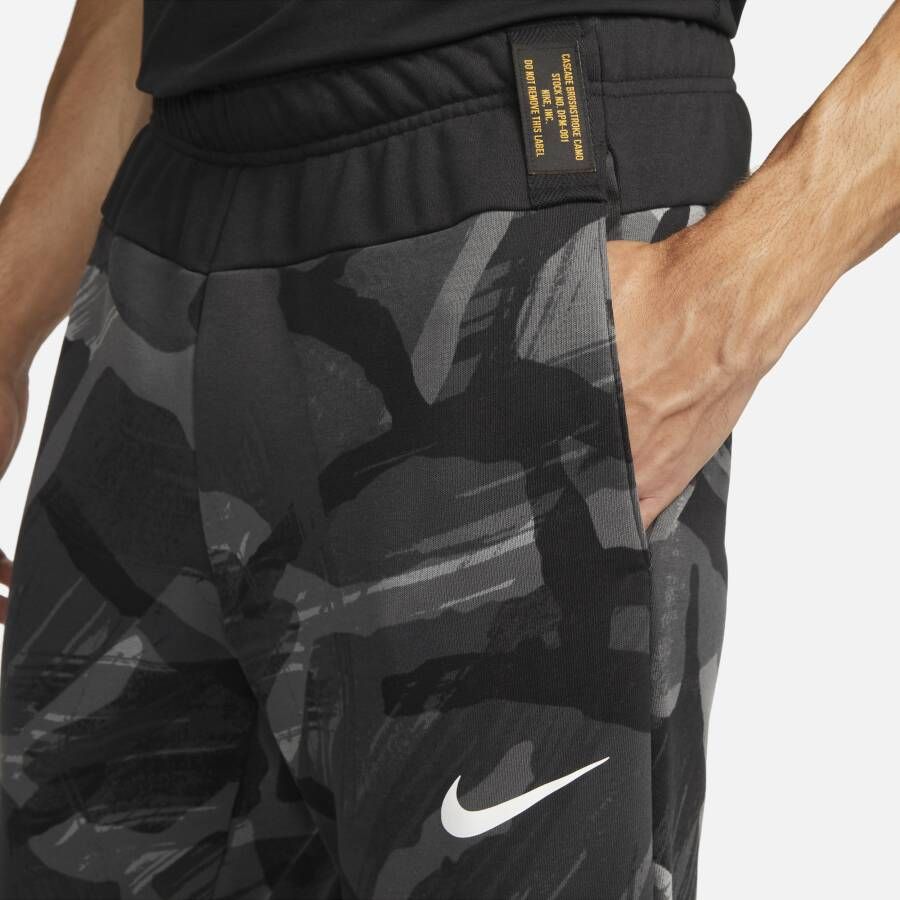 Nike Dri-FIT fitnessbroek met taps toelopend design en camouflageprint voor heren Zwart