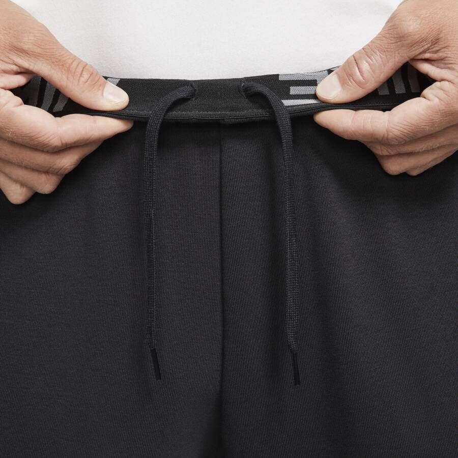 Nike Dry Dri-FIT toelopende fitnessbroek van fleece voor heren Zwart