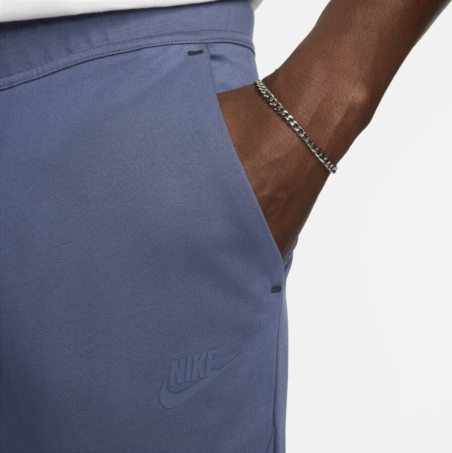 Nike Sportswear Tech Fleece Lightweight joggingbroek met aansluitende pasvorm voor heren Blauw