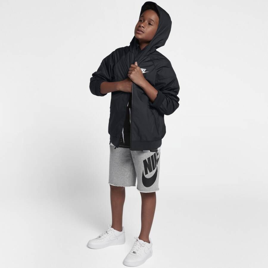 Nike Sportswear Windrunner ruimvallend jongensjack op heuplengte met capuchon Zwart