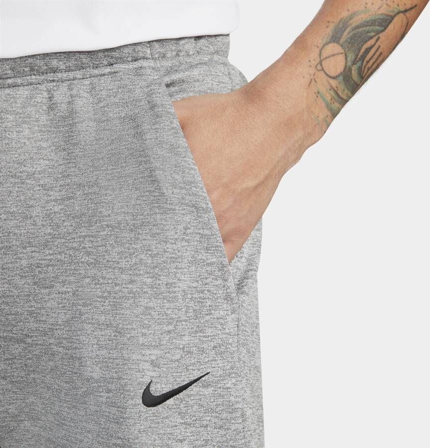 Nike Therma-FIT toelopende fitnessbroek voor heren Grijs