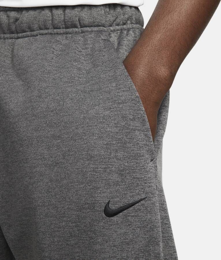 Nike Therma-FIT toelopende fitnessbroek voor heren Grijs