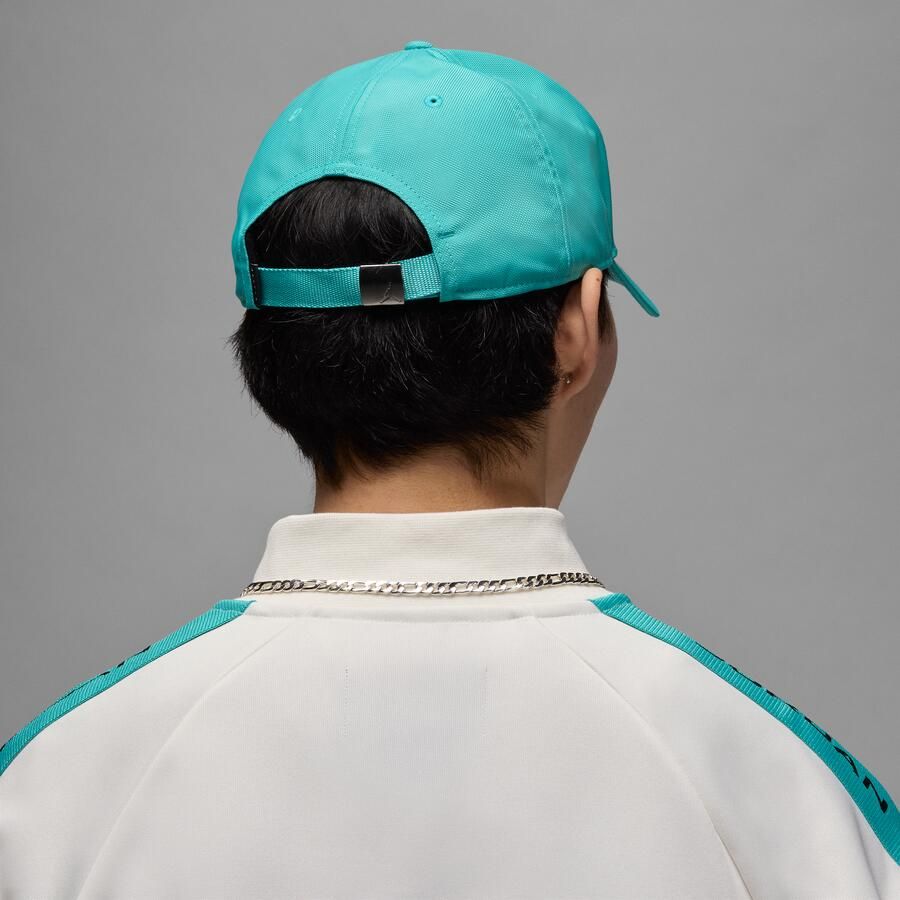 Jordan Rise gestructureerde pet met metalen Jump Groen