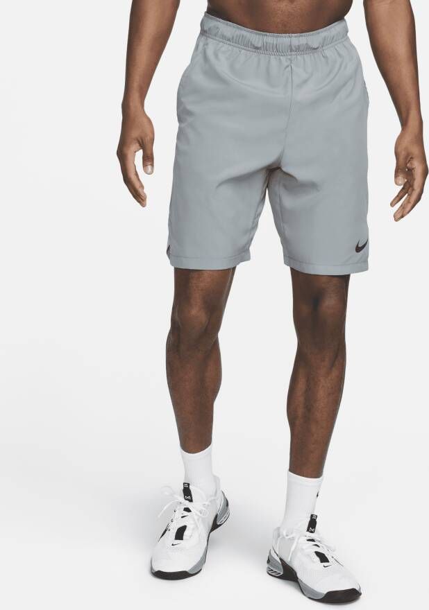 Nike Dri-FIT Geweven trainingsshorts voor heren (23 cm) Grijs