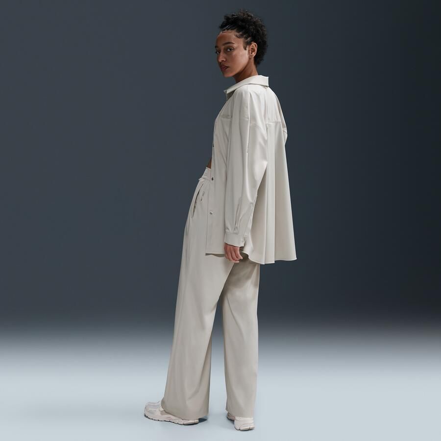 Nike 24.7 PerfectStretch Dri-FIT ruime damesbroek met hoge taille en wijde pijpen Bruin - Foto 3