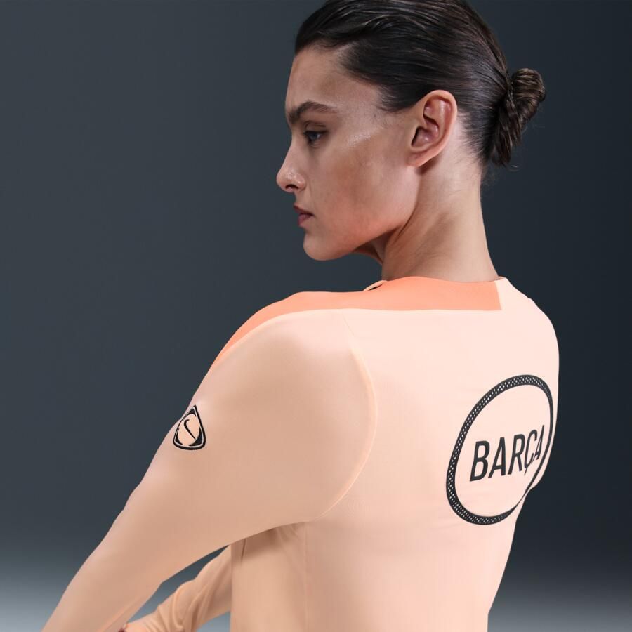 Nike FC Barcelona Strike Derde Total 90 knit voetbaltop met ronde hals en Dri-FIT voor dames Oranje