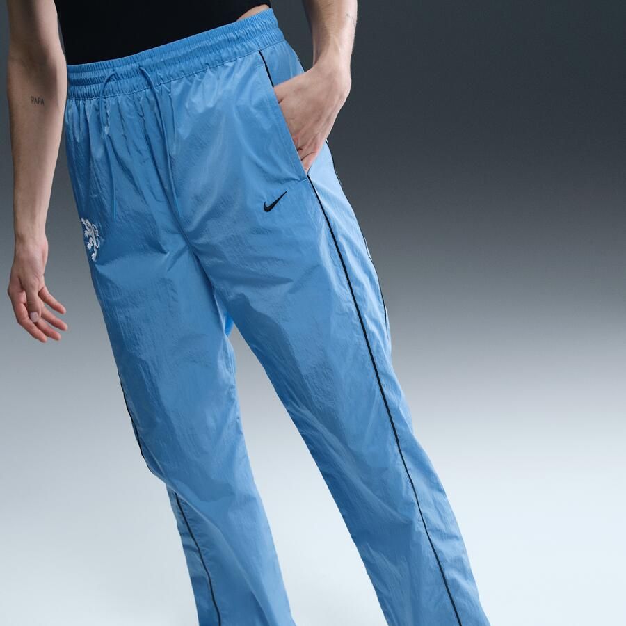 Nike Nederland Windrunner geweven voetbalbroek met hoge taille voor dames Blauw