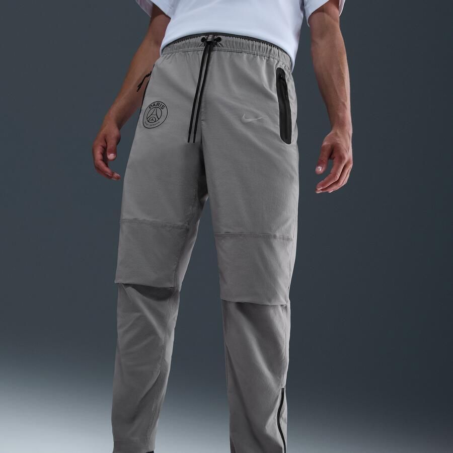 Nike Paris Saint-Germain FC Tech geweven voetbalbroek voor heren Grijs