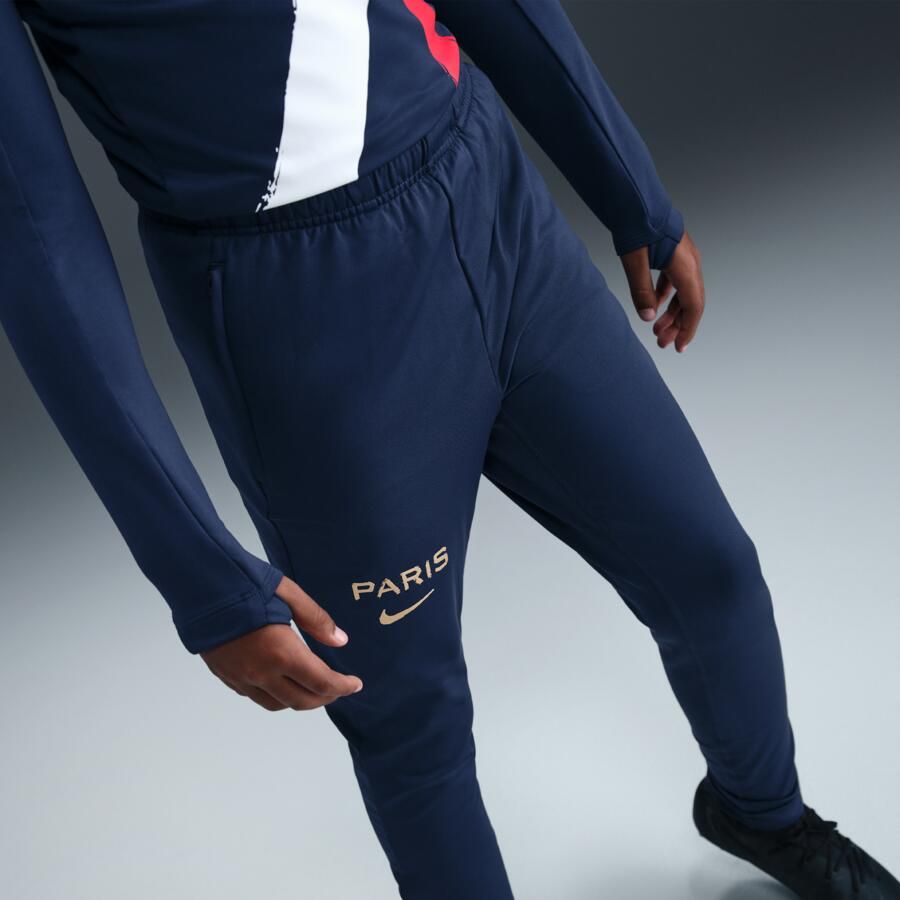 Nike Paris Saint-Germain Strike Uit knit voetbalbroek met Dri-FIT voor kids Blauw