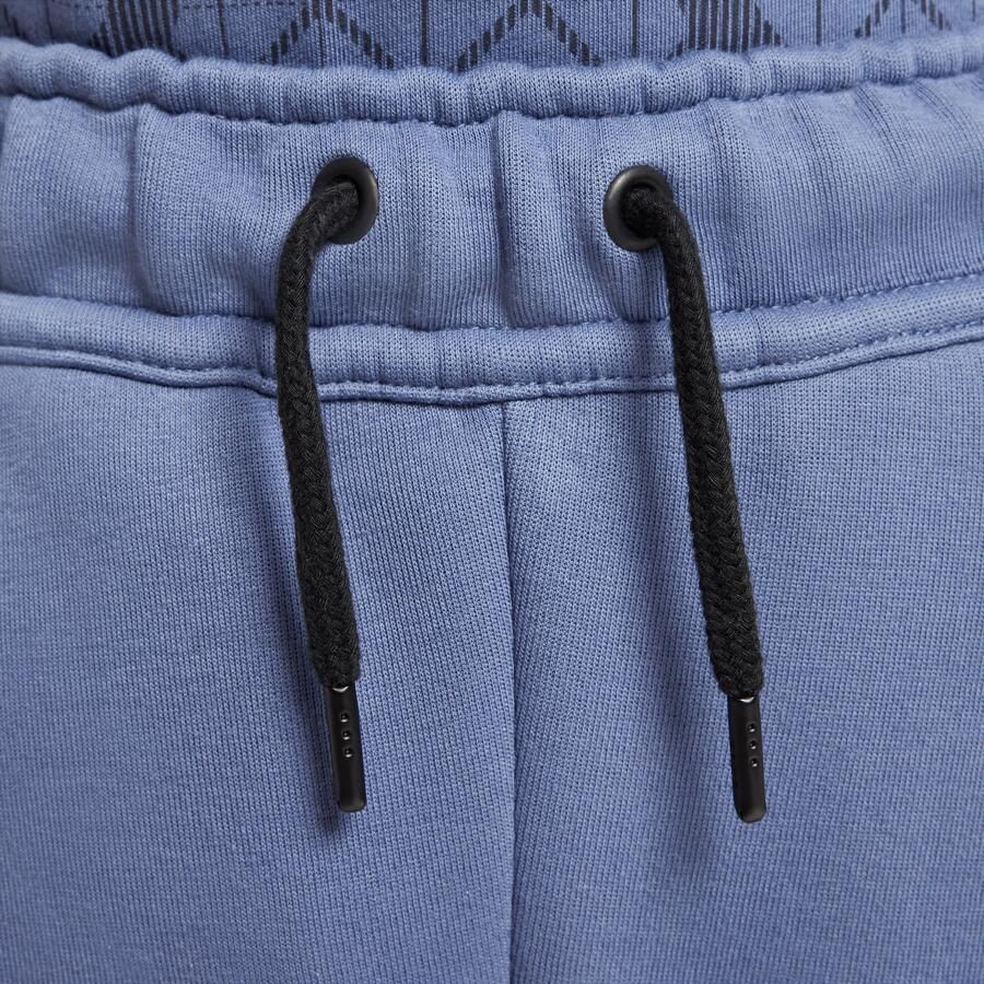 Nike Paris Saint-Germain Tech voetbalbroek van fleece voor jongens Blauw