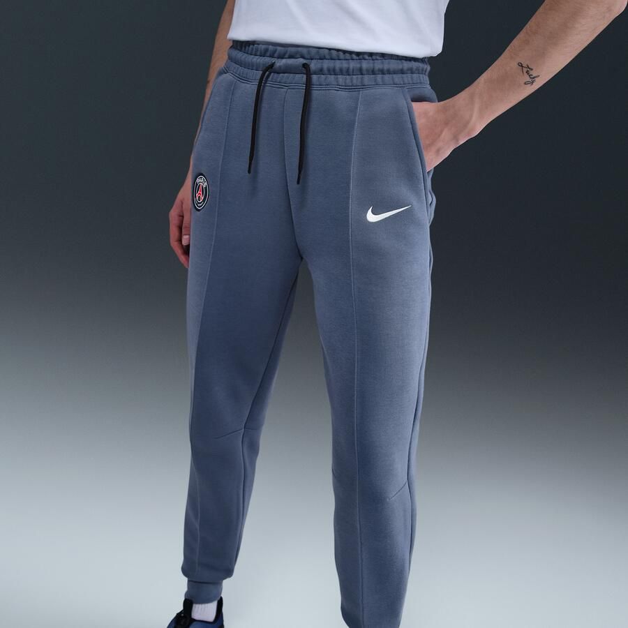 Nike Paris Saint-Germain Tech voetbaljoggingbroek van fleece met halfhoge taille voor dames Blauw