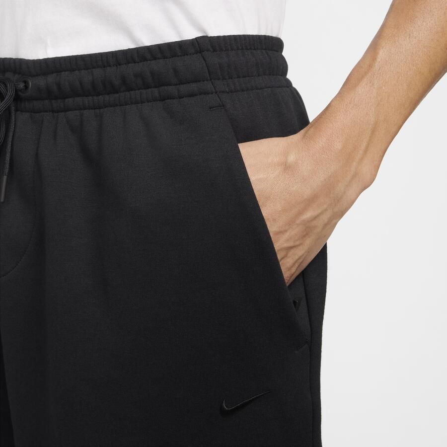 Nike Primary Fleece Dri-FIT niet-gevoerde performanceshorts voor heren (18 cm) Zwart