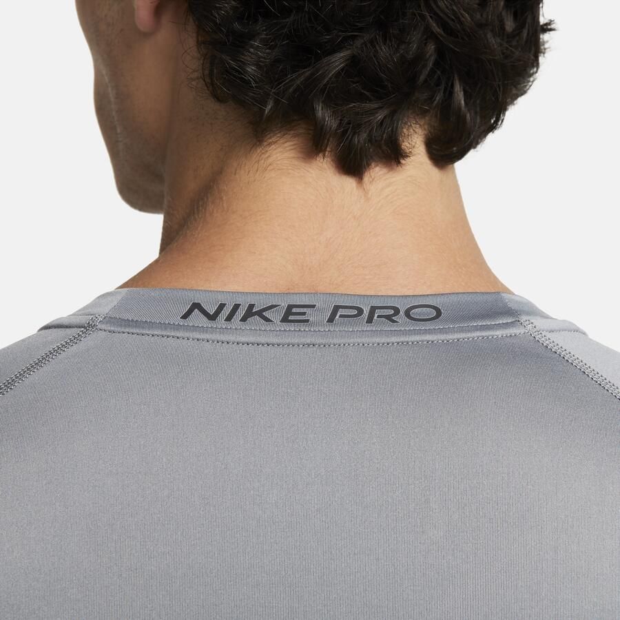 Nike Pro Dri-FIT strakke fitnesstop met lange mouwen voor heren Grijs