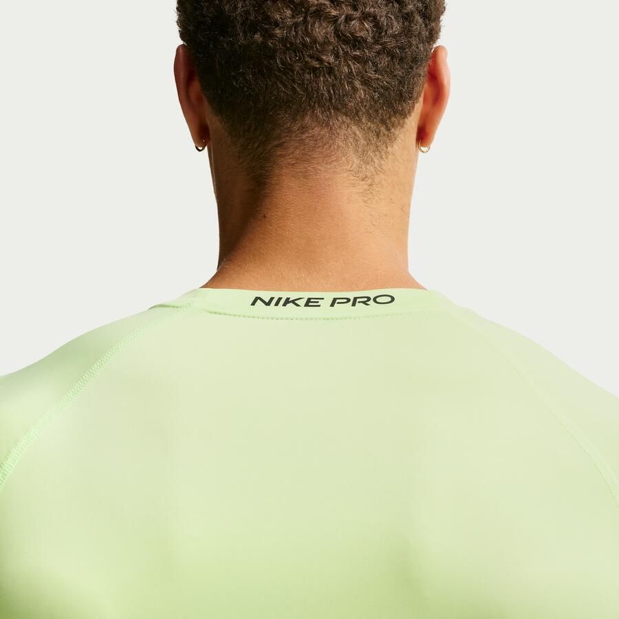 Nike Pro Dri-FIT strakke fitnesstop met lange mouwen voor heren Groen